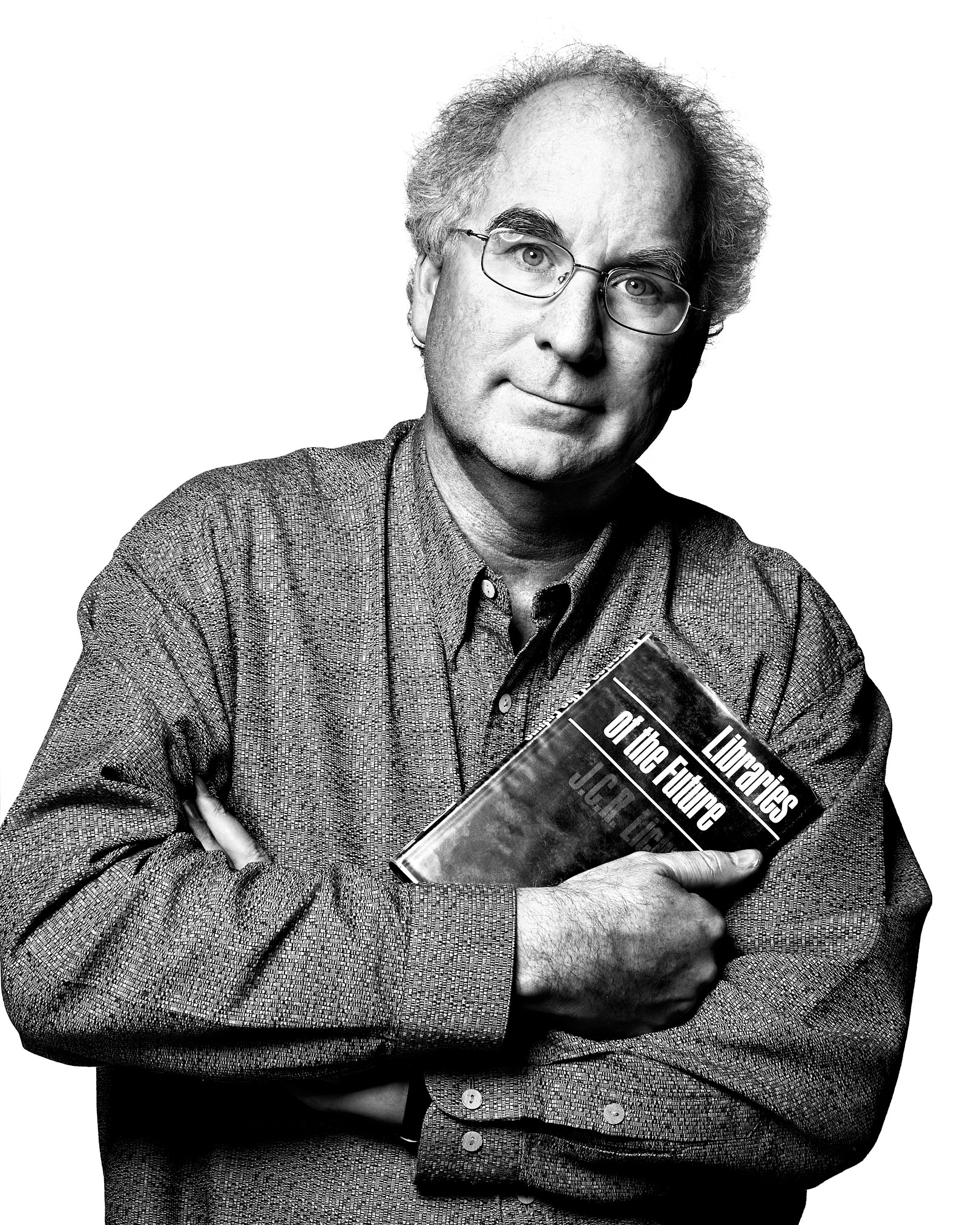 Portrait of Brewster Kahle holding J.C.R. Licklider's Libraries of the Future.